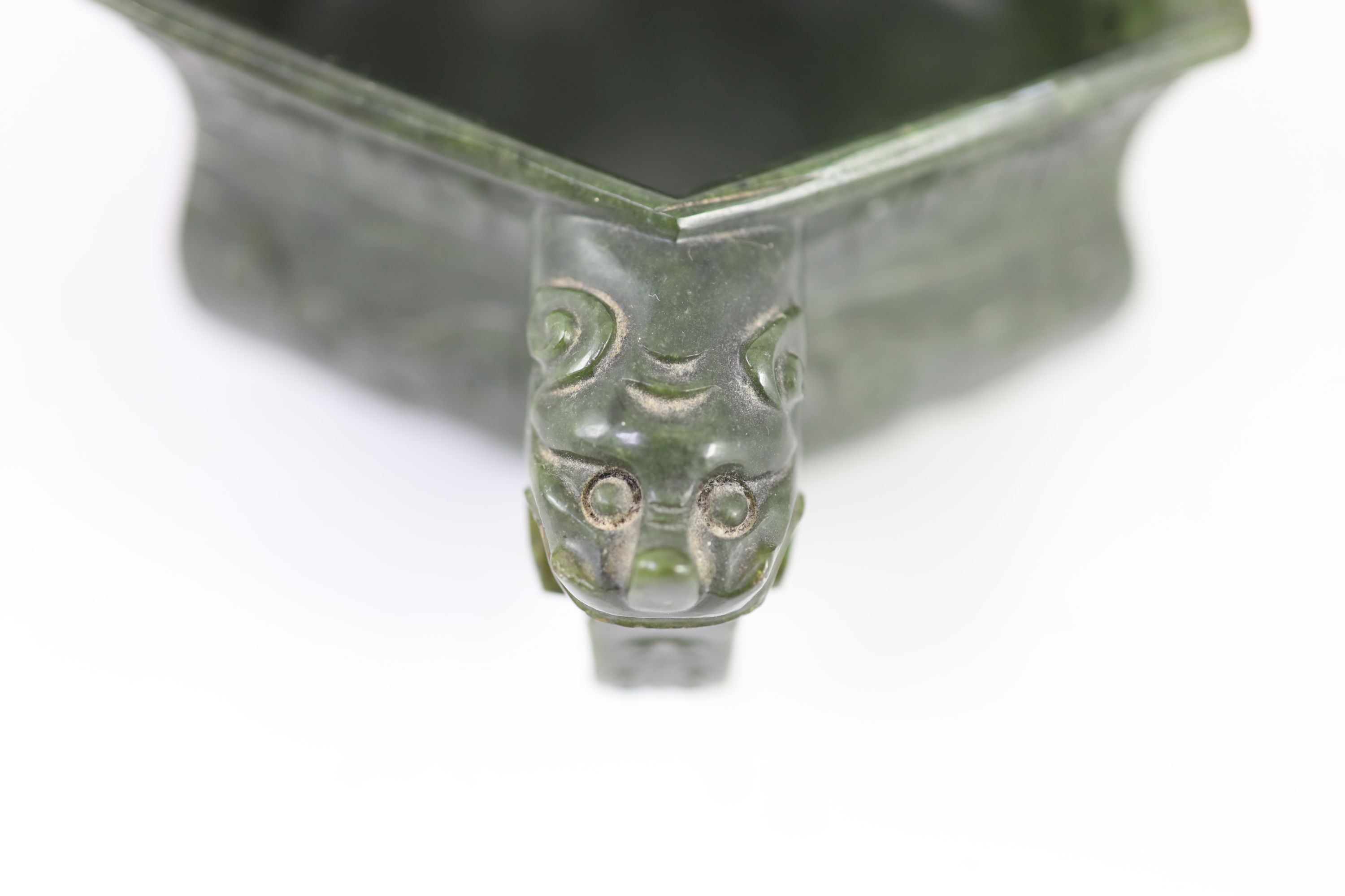 A Chinese archaistic spinach green jade hexagonal censer, 19th century, 17.5cm wide